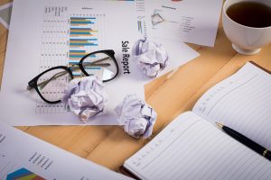 business workplace with paper chart,graph and money. Business finance concept.