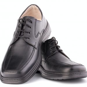 Black glossy man’s shoes with shoelaces